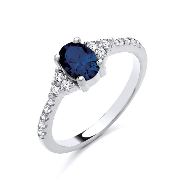 STERLING SILVER OVAL SOLITAIRE SIMULATED SAPPHIRE & CZ RING