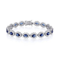 STERLING SILVER SIMULATED SAPPHIRE & CZ OVAL HALO BRACELET – 7.5 INCH